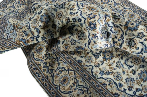 Surface texture of 2000s Kashan rug with natural Wool and intricate pattern