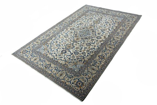 Corner detail of 2000s Kashan rug showing border pattern and Wool pile