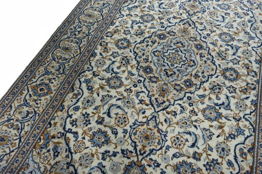 Backside of handmade 2000s Kashan rug showing knot structure and weave density