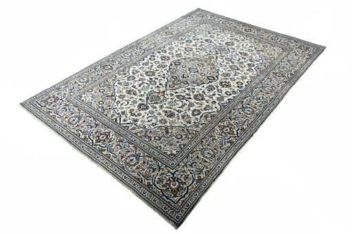 Corner detail of 2000s Kashan rug showing border pattern and Wool pile