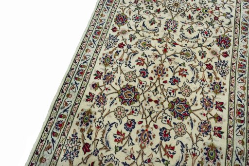 Backside of handmade New Kashan rug showing knot structure and weave density