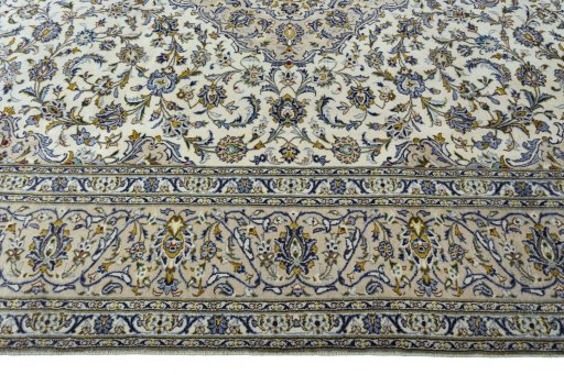 Corner detail of 2000s Kashan rug showing border pattern and Wool pile