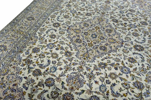 Backside of handmade 2000s Kashan rug showing knot structure and weave density