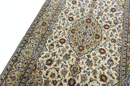 Backside of handmade 2000s Kashan rug showing knot structure and weave density