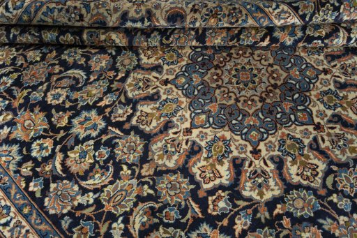 Close-up detail of 2000s Kashan rug from Iran / Persia showing Wool weave