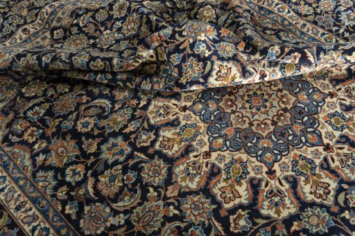 Surface texture of 2000s Kashan rug with natural Wool and intricate pattern