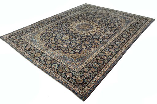 Corner detail of 2000s Kashan rug showing border pattern and Wool pile