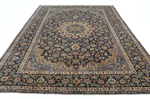 Surface texture of 2000s Kashan rug with natural Wool and intricate pattern