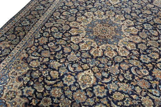 Backside of handmade 2000s Kashan rug showing knot structure and weave density