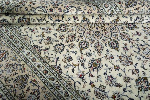 Close-up detail of 2000s Kashan rug from Iran / Persia showing Wool weave