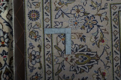 Backside of handmade 2000s Kashan rug showing knot structure and weave density