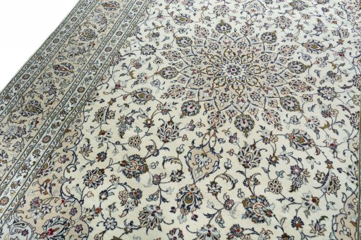 Backside of handmade 2000s Kashan rug showing knot structure and weave density