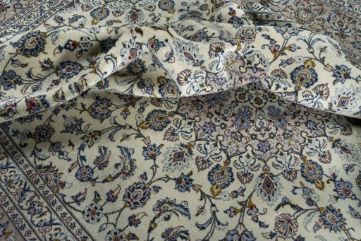 Surface texture of 2000s Kashan rug with natural Wool and intricate pattern