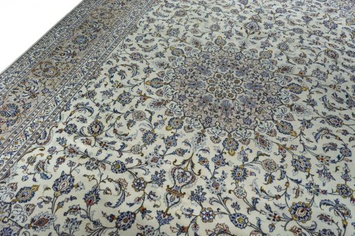 Backside of handmade 2000s Kashan rug showing knot structure and weave density