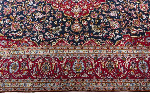 Corner detail of New Kashan rug showing border pattern and Cork pile