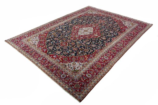Corner detail of New Kashan rug showing border pattern and Cork pile