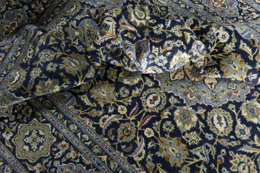 Surface texture of 2000s Kashan rug with natural Wool and intricate pattern