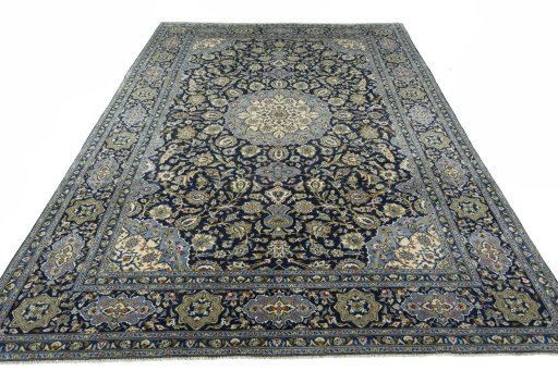 Surface texture of 2000s Kashan rug with natural Wool and intricate pattern