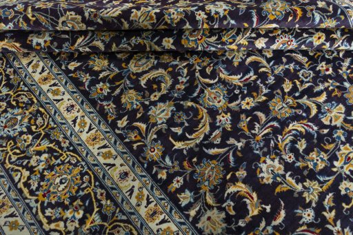 Close-up detail of 2000s Kashan rug from Iran / Persia showing Wool weave