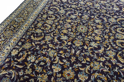 Backside of handmade 2000s Kashan rug showing knot structure and weave density