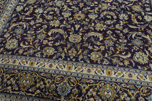 Close-up detail of 2000s Kashan rug from Iran / Persia showing Wool weave