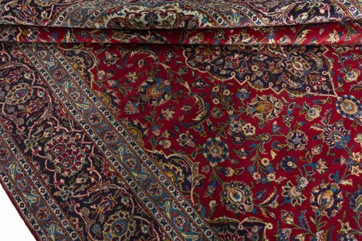 Close-up detail of 2000s Kashan rug from Iran / Persia showing Wool weave