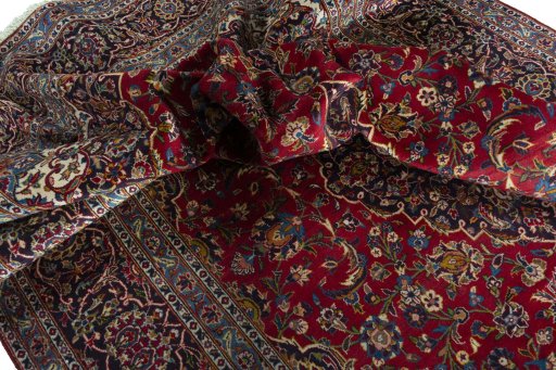 Surface texture of 2000s Kashan rug with natural Wool and intricate pattern