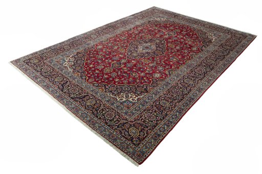 Corner detail of 2000s Kashan rug showing border pattern and Wool pile