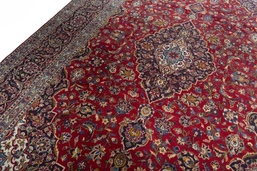 Backside of handmade 2000s Kashan rug showing knot structure and weave density