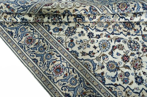 Close-up detail of 2000s Kashan rug from Iran / Persia showing Wool weave