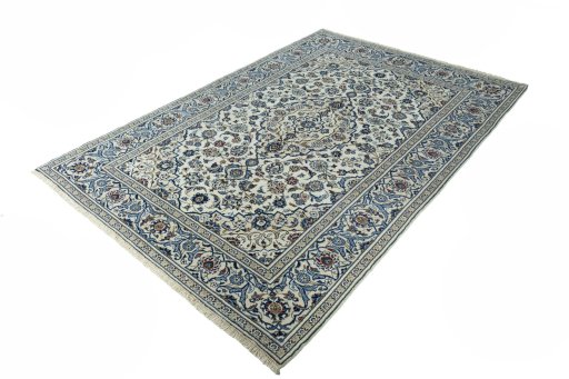 Corner detail of 2000s Kashan rug showing border pattern and Wool pile