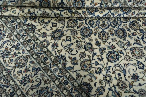 Close-up detail of 2000s Kashan rug from Iran / Persia showing Wool weave