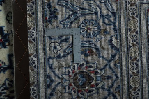 Backside of handmade 2000s Kashan rug showing knot structure and weave density