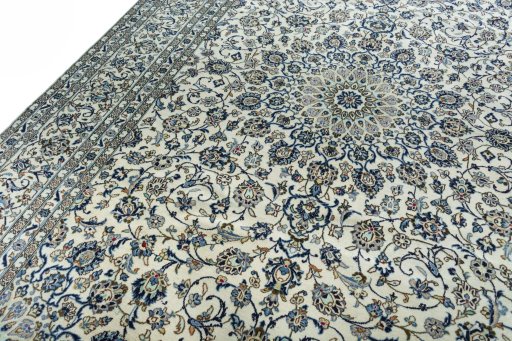 Backside of handmade 2000s Kashan rug showing knot structure and weave density