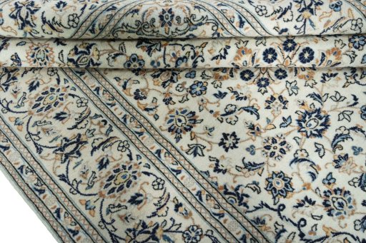 Close-up detail of 2000s Kashan rug from Iran / Persia showing Wool weave