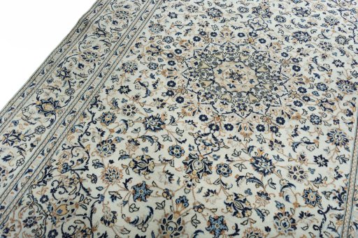 Backside of handmade 2000s Kashan rug showing knot structure and weave density