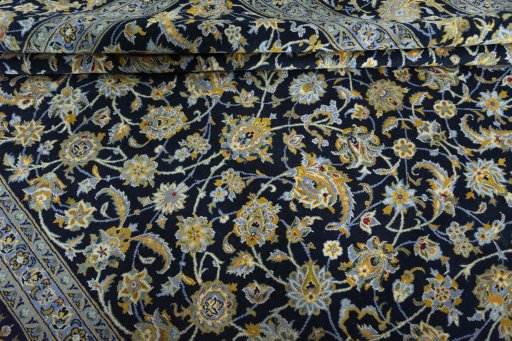 Close-up detail of 2000s Kashan rug from Iran / Persia showing Wool weave