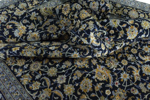 Surface texture of 2000s Kashan rug with natural Wool and intricate pattern