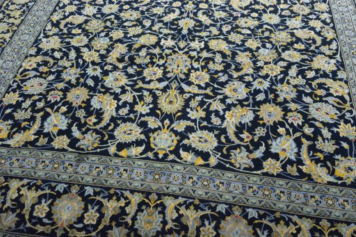 Close-up detail of 2000s Kashan rug from Iran / Persia showing Wool weave