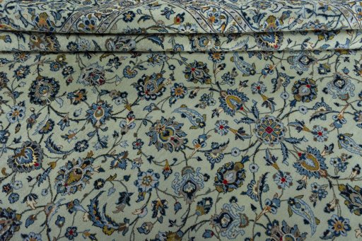 Close-up detail of 2000s Kashan rug from Iran / Persia showing Wool weave