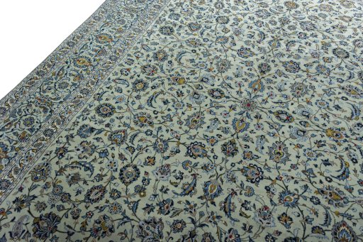 Backside of handmade 2000s Kashan rug showing knot structure and weave density