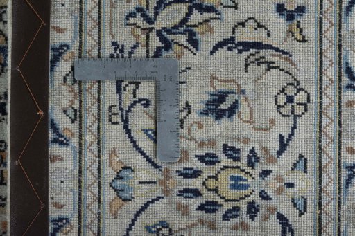 Backside of handmade 2000s Kashan rug showing knot structure and weave density