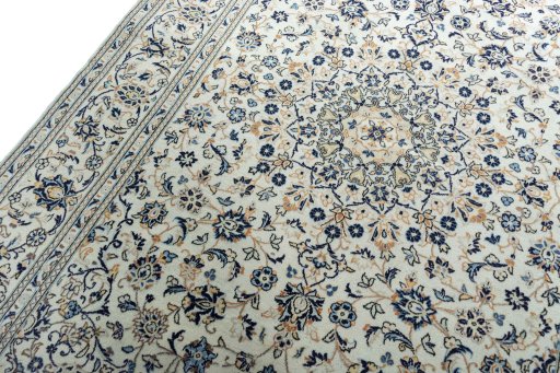 Backside of handmade 2000s Kashan rug showing knot structure and weave density