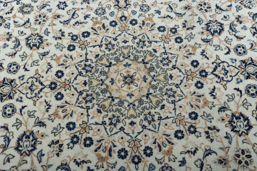 Central medallion detail of 2000s Kashan rug from Iran / Persia