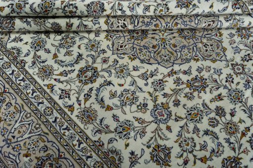 Close-up detail of 2000s Kashan rug from Iran / Persia showing Wool weave