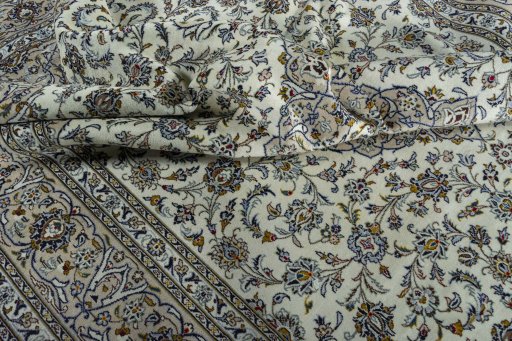 Surface texture of 2000s Kashan rug with natural Wool and intricate pattern