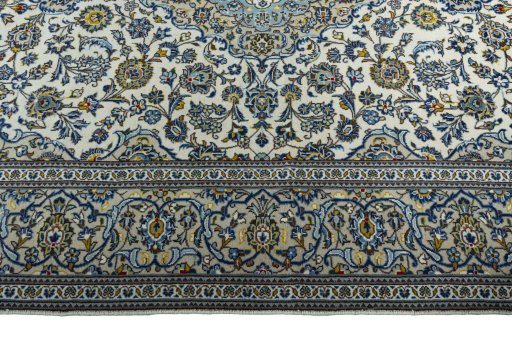 Corner detail of 2000s Kashan rug showing border pattern and Wool pile