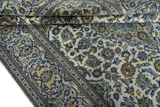 Close-up detail of 2000s Kashan rug from Iran / Persia showing Wool weave