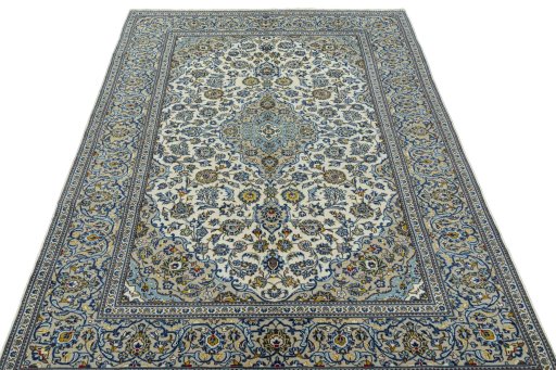 Surface texture of 2000s Kashan rug with natural Wool and intricate pattern
