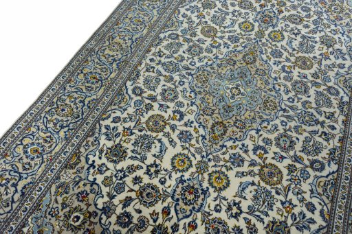 Backside of handmade 2000s Kashan rug showing knot structure and weave density
